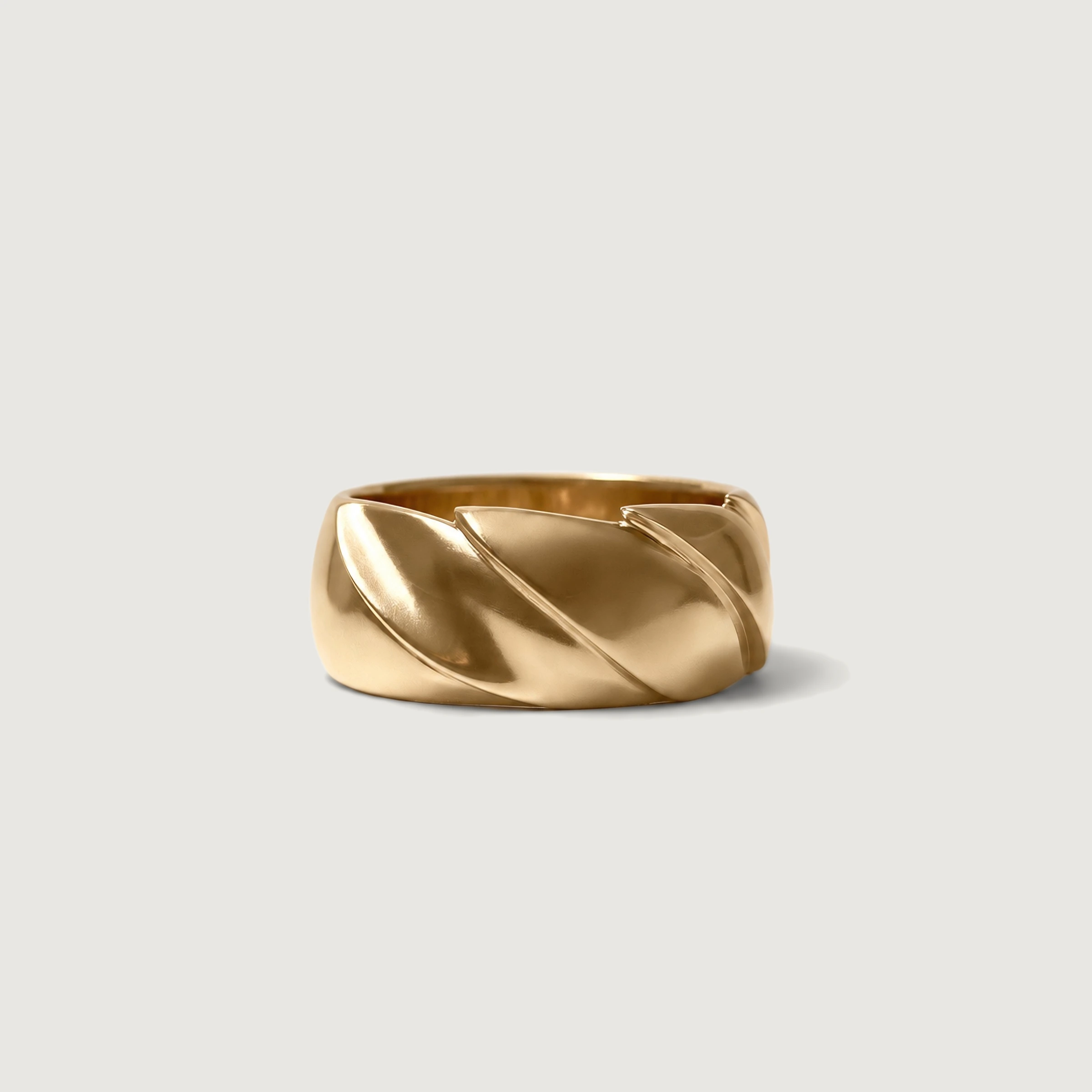 A gold band carved with a spiral, a custom commission